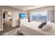 Main bedroom with water views, walk-in closet, and ensuite bathroom at 200 Harbor Walk Dr # 243, Punta Gorda, FL 33950