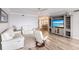 Bright living room with hardwood floors and entertainment center at 200 Harbor Walk Dr # 243, Punta Gorda, FL 33950