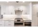 Modern kitchen with white cabinets and granite countertops at 200 Harbor Walk Dr # 243, Punta Gorda, FL 33950