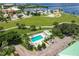 Community pool with surrounding patio and parking at 200 Harbor Walk Dr # 243, Punta Gorda, FL 33950