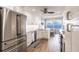 Updated kitchen featuring white cabinets, stainless steel appliances, and a water view at 200 Harbor Walk Dr # 243, Punta Gorda, FL 33950
