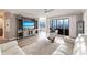 Living room features water views, hardwood floors, and comfy seating at 200 Harbor Walk Dr # 243, Punta Gorda, FL 33950