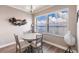 Charming dining room with water views and a round table at 200 Harbor Walk Dr # 243, Punta Gorda, FL 33950