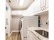 Laundry room features new washer, dryer, and ample storage at 200 Harbor Walk Dr # 243, Punta Gorda, FL 33950