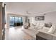 Spacious living room with water view and light hardwood floors at 200 Harbor Walk Dr # 243, Punta Gorda, FL 33950