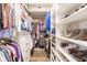Large walk-in closet with ample shelving and hanging space at 200 Harbor Walk Dr # 243, Punta Gorda, FL 33950