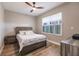 Spacious bedroom with wood flooring, ceiling fan, and a dresser at 200 Harbor Walk Dr # 243, Punta Gorda, FL 33950