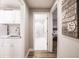 Bright hallway with view into bathroom and bedroom, plus an inspirational sign at 200 Harbor Walk Dr # 243, Punta Gorda, FL 33950