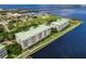 Aerial view of waterfront property with a multi-story building and marina at 200 Harbor Walk Dr # 243, Punta Gorda, FL 33950