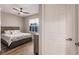 Cozy bedroom with wood flooring, a ceiling fan, and window shutters at 200 Harbor Walk Dr # 243, Punta Gorda, FL 33950