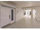White building entrance with tiled floor and security door at 200 Harbor Walk Dr # 243, Punta Gorda, FL 33950