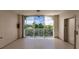 Hallway with elevator and large window offering scenic views at 200 Harbor Walk Dr # 243, Punta Gorda, FL 33950