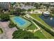 Well-maintained tennis court with surrounding landscaping at 200 Harbor Walk Dr # 243, Punta Gorda, FL 33950