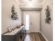 Bright entryway with hardwood floors and decorative wall art at 200 Harbor Walk Dr # 243, Punta Gorda, FL 33950