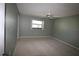 Bright bedroom with neutral walls and carpeting at 255 Mission S Trl # J, Venice, FL 34285