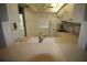 Kitchen with white cabinets and a breakfast bar at 255 Mission S Trl # J, Venice, FL 34285