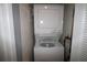 Stackable washer and dryer in a dedicated laundry room at 255 Mission S Trl # J, Venice, FL 34285