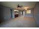 Spacious living room with neutral walls and carpeting at 255 Mission S Trl # J, Venice, FL 34285