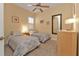 Comfortable bedroom featuring carpet, neutral colors, and a large mirror at 13064 Creekside Ln, Port Charlotte, FL 33953