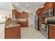 A well-equipped kitchen with stainless steel appliances, granite countertops, and ample cabinet space at 13064 Creekside Ln, Port Charlotte, FL 33953
