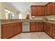 Open kitchen featuring granite countertops, stainless steel appliances, and wood cabinetry at 13064 Creekside Ln, Port Charlotte, FL 33953