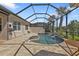 Private pool and spa surrounded by stone pavers and a screened enclosure for ultimate relaxation at 13064 Creekside Ln, Port Charlotte, FL 33953