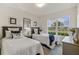 Guest bedroom with twin beds and window overlooking street at 1817 W Price Blvd, North Port, FL 34286