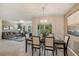 Elegant dining room with chandelier and view to living room at 1817 W Price Blvd, North Port, FL 34286