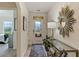 Bright entryway with decorative mirror and view to backyard at 1817 W Price Blvd, North Port, FL 34286