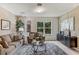Cozy living room featuring comfortable seating and large windows at 1817 W Price Blvd, North Port, FL 34286