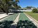 Community shuffleboard courts amidst a serene and well-maintained neighborhood at 19375 Water Oak Dr # 302, Port Charlotte, FL 33948