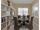 Bright dining area with built-in shelving and round table at 13064 Creekside Ln, Port Charlotte, FL 33953