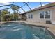 Enjoy this refreshing pool with a waterfall feature at 13064 Creekside Ln, Port Charlotte, FL 33953