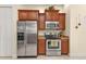 Modern kitchen with stainless steel appliances and wood cabinets at 13064 Creekside Ln, Port Charlotte, FL 33953