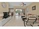 Comfortable living room with access to the pool and kitchen at 13064 Creekside Ln, Port Charlotte, FL 33953