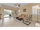 Relaxing living room with sliding doors leading to the pool area at 13064 Creekside Ln, Port Charlotte, FL 33953