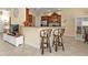 Kitchen boasts a breakfast bar with two stools at 13064 Creekside Ln, Port Charlotte, FL 33953