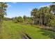 Landscaped backyard with lush greenery at 13064 Creekside Ln, Port Charlotte, FL 33953