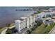 Aerial view of waterfront building with pool and parking at 1500 Park Beach Cir # 4A, Punta Gorda, FL 33950