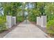 Long driveway leads to home through a gated entrance at 1285 Casper St, Port Charlotte, FL 33953