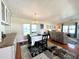 Charming dining area with table and chairs, view into living room at 743 Tangerine Woods Blvd, Englewood, FL 34223