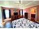 Relaxing bedroom with a large bed, plenty of natural light, and a view of the backyard at 743 Tangerine Woods Blvd, Englewood, FL 34223