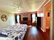 Spacious bedroom with wood floors, large bed, and plenty of closet space at 743 Tangerine Woods Blvd, Englewood, FL 34223