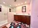 Updated bathroom with a walk-in shower, new vanity, and stylish flooring at 743 Tangerine Woods Blvd, Englewood, FL 34223