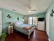 Bright bedroom with double bed, wood floors, and decorative accents at 743 Tangerine Woods Blvd, Englewood, FL 34223