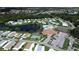 Community clubhouse, pool, and tennis courts overview at 743 Tangerine Woods Blvd, Englewood, FL 34223
