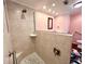 Well-appointed bathroom with a walk-in shower and modern vanity at 743 Tangerine Woods Blvd, Englewood, FL 34223