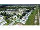 Aerial view showing home location in community with lake at 743 Tangerine Woods Blvd, Englewood, FL 34223