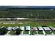 Aerial view of mobile home community, highlighting property location at 743 Tangerine Woods Blvd, Englewood, FL 34223