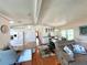 Open kitchen with white cabinets, island, and views to living areas at 743 Tangerine Woods Blvd, Englewood, FL 34223